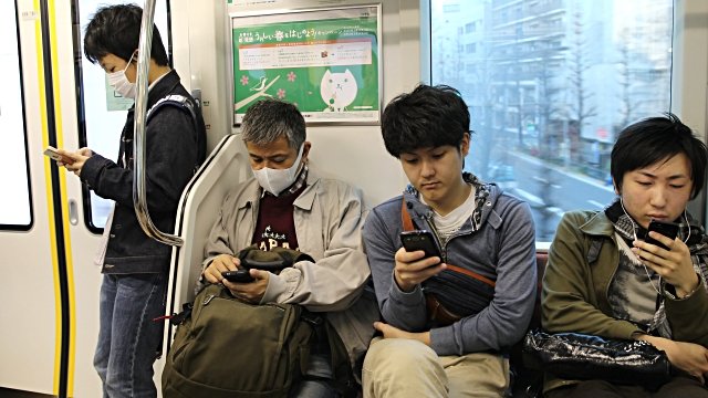 Commuters wearing face masks